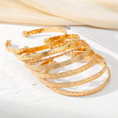 8-Piece Floral Accented Adjustable Textured Cuff Stack