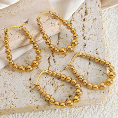 Graduated Bead Oval Hoop Earrings