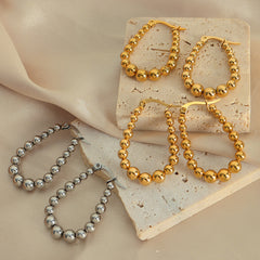 Graduated Bead Oval Hoop Earrings