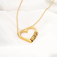 Heart necklace with engraved pearls