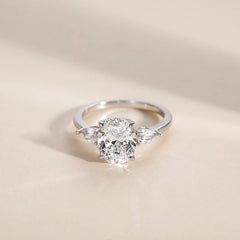 Sterling Silver Elegant Pear Accented Oval Brilliant Cut Ring