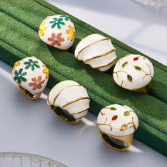 Gold-Tone Enamel and Mother-of-Pearl Ring Designs