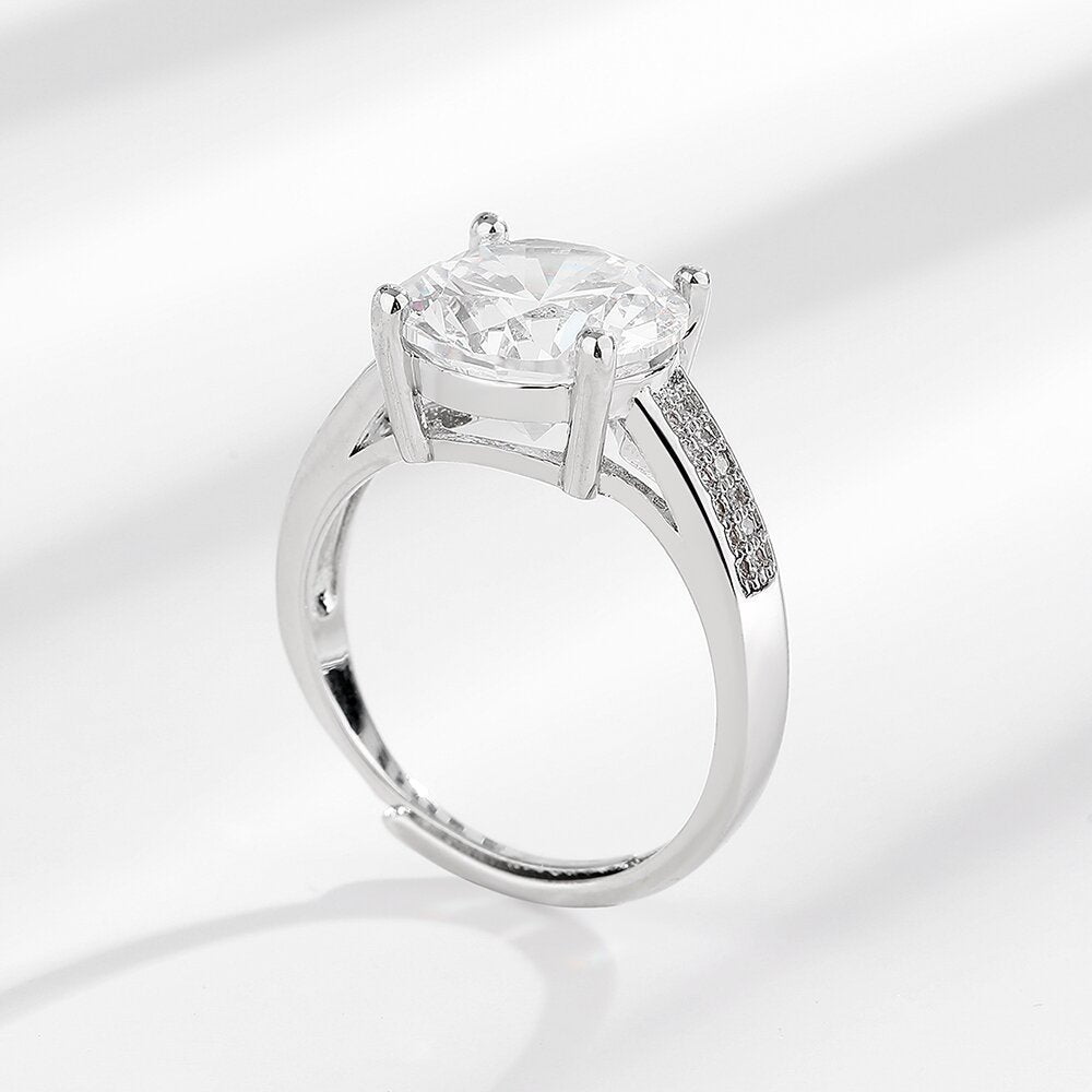 Lumière Charm Ring on a clean background